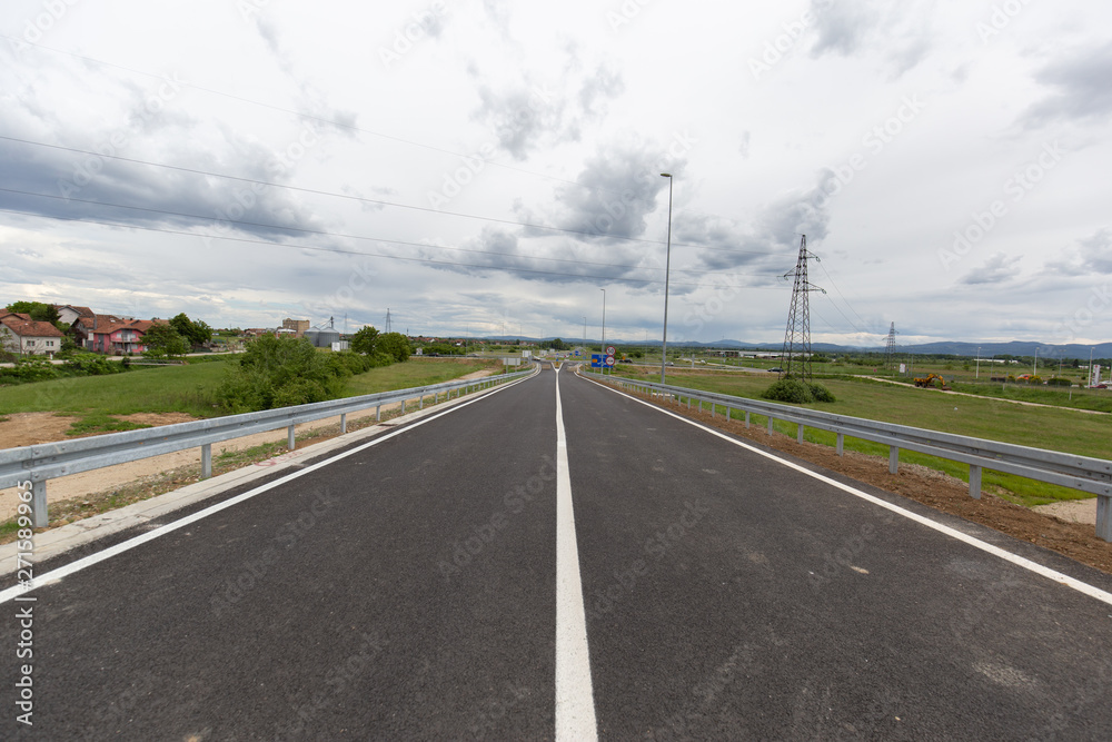 A new recently built highway in Brcko district, Bosnia and Herzegovina. The road was built by Spanish company Rubau and is important for the region A new recently built highway in Brcko district, Bosnia and Herzegovina. The road was built by Spanish company Rubau and is important for the region