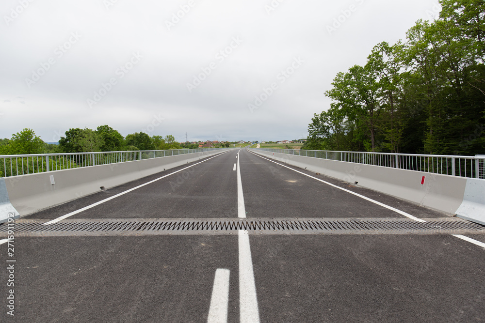 A new recently built highway in Brcko district, Bosnia and Herzegovina. The road was built by Spanish company Rubau and is important for the region A new recently built highway in Brcko district, Bosnia and Herzegovina. The road was built by Spanish company Rubau and is important for the region