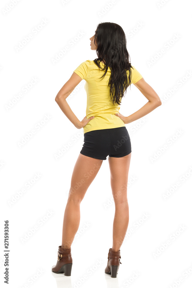 Rear View Of Woman With Hands On Hip Rear View Of Woman With Hands On Hip