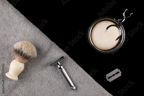 Traditional wet shaving. Shaving brush, safety razor, towel and soap.