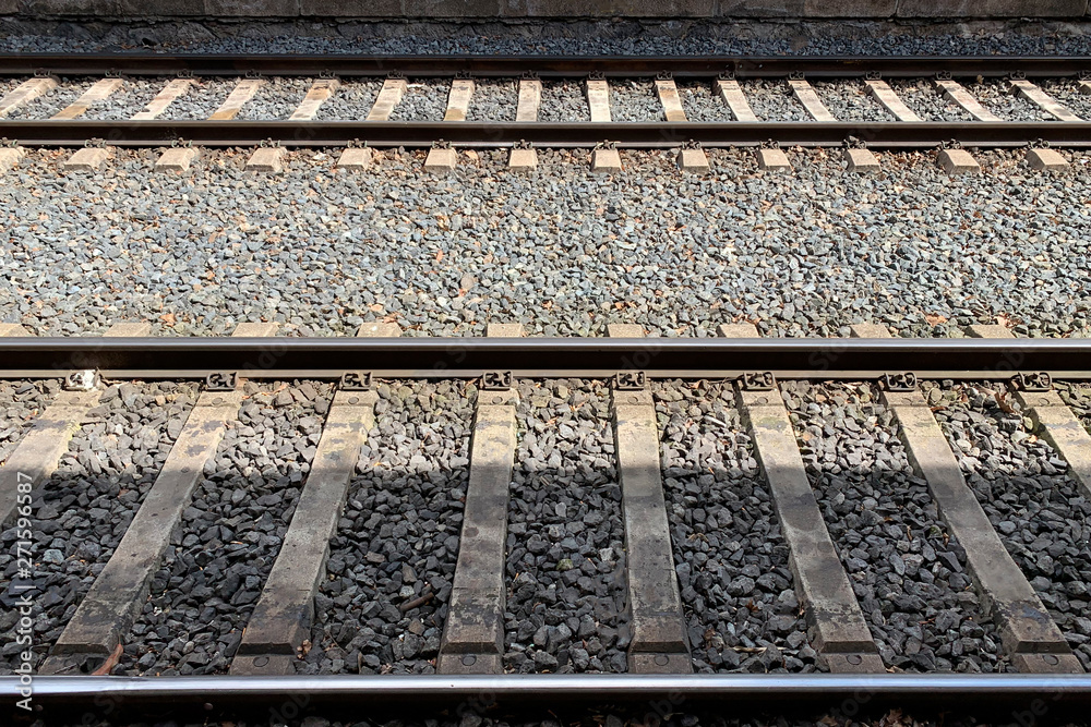 rails from the platform of the train station rails from the platform of the train station