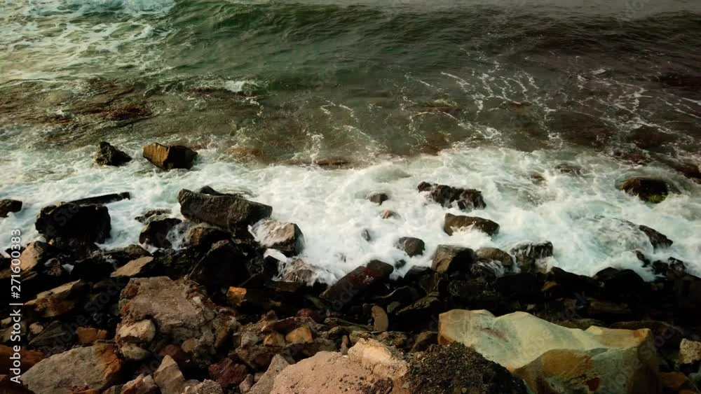 Waves crashing on a rocky shoreline. Waves crashing on a rocky shoreline.