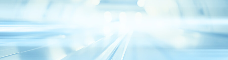 blurred background metro escalator / light blue background movement city infrastructure subway