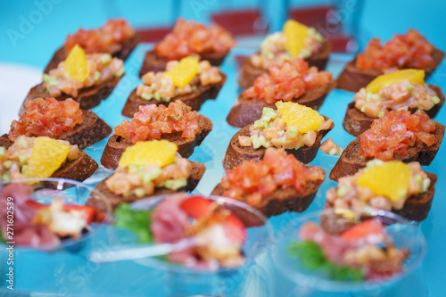 Canapes and light meals, tapas on the table in the restaurant.