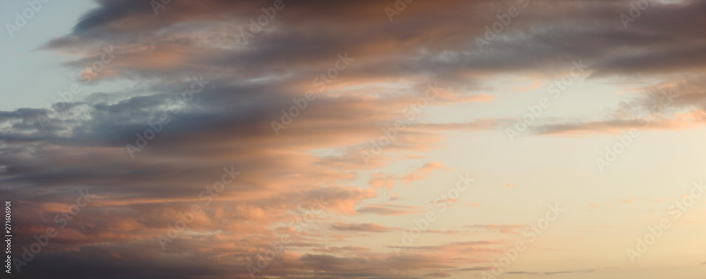 sunset over the sea, with light orange clouds