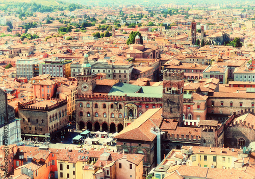 Aerial panoramic cityscape of Bologna  Italy  above rooftops of typical houses  ancient buildings and medieval towers