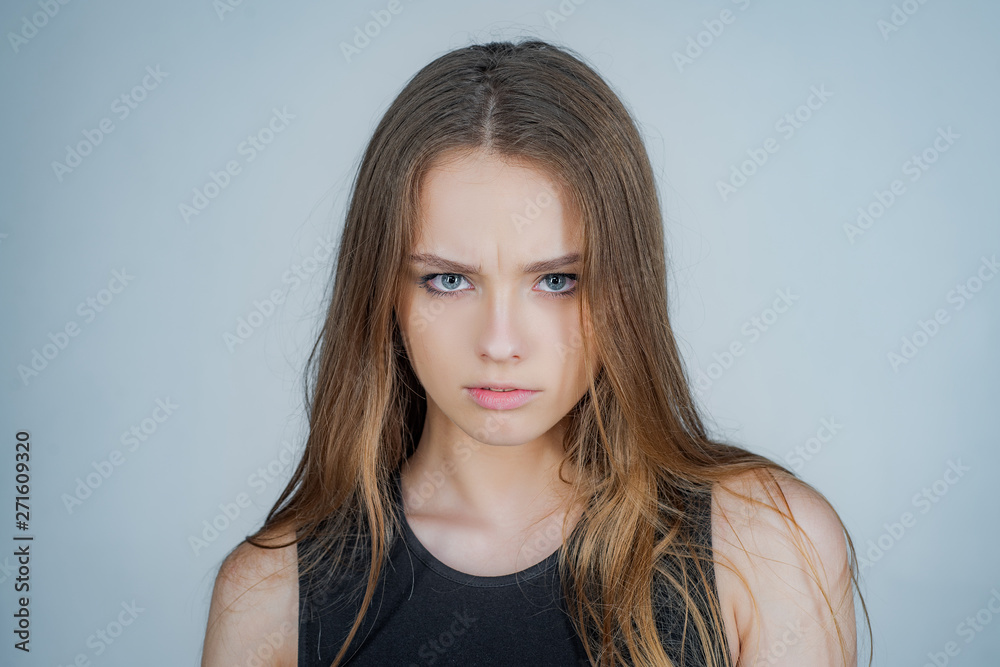 Fashion portrait of a beautiful young woman posing over white background. Close up portrait of a beautiful young woman with blonde hair. Fashion portrait of a beautiful young woman posing over white background. Close up portrait of a beautiful young woman with blonde hair.