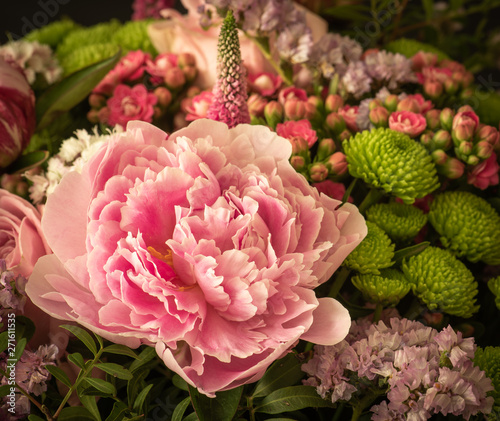 white pink peony in a pastel vintage color spring flower bouquet with chrysanthemums,kalanchoes,rose,dianthus photo