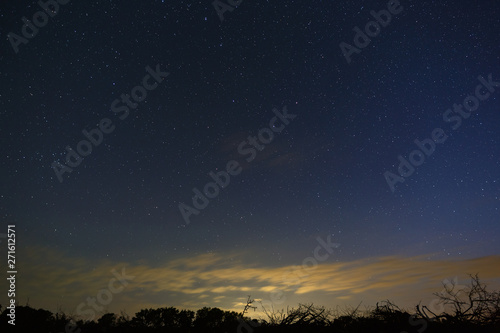 Bright stars in the night sky after sunset. Outer space photographed with long exposure.