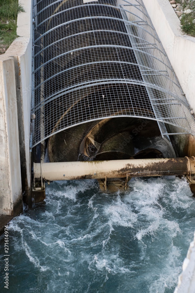 Archimedean screw turbine generating electric energy from the water