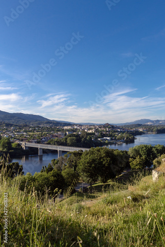 Beautiful and verdant landscape with the river and the bridge that connects Valenca and Tui