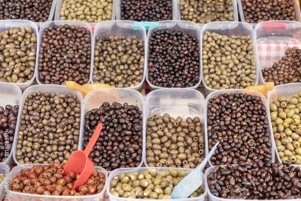Kotor, Montenegro - Variety of green, red and black olives for sale at the local green market stand Kotor, Montenegro - Variety of green, red and black olives for sale at the local green market stand