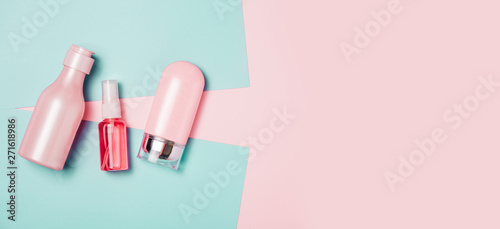 Creative minimal beauty and health background with pink bottle