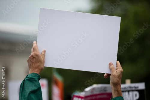 Canvastavla A person holding a blank protest banner at a political rally