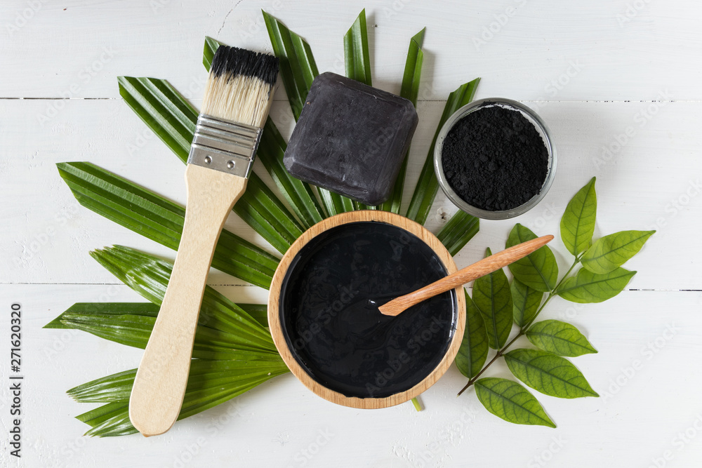 Homemade skin remedies and facial care, activated black charcoal and yogurt mask, cosmetic product