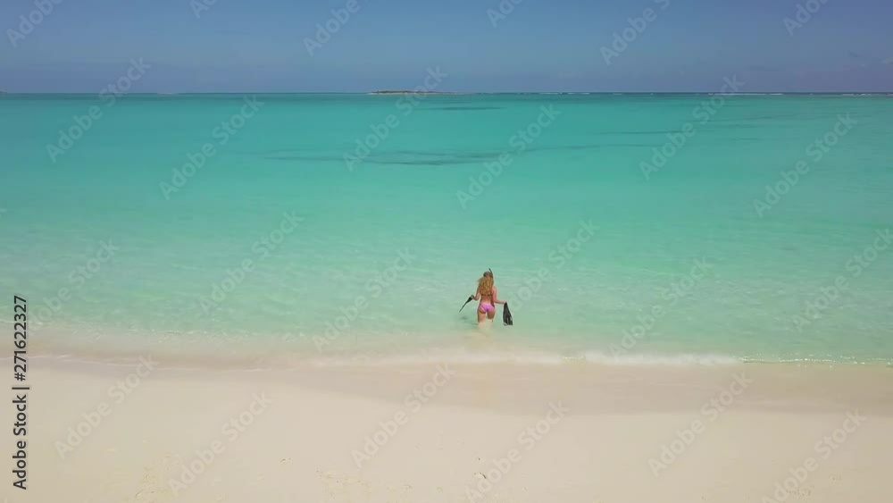 Female snorkeler in turquoise waters. exuma bahamas Female snorkeler in turquoise waters. exuma bahamas