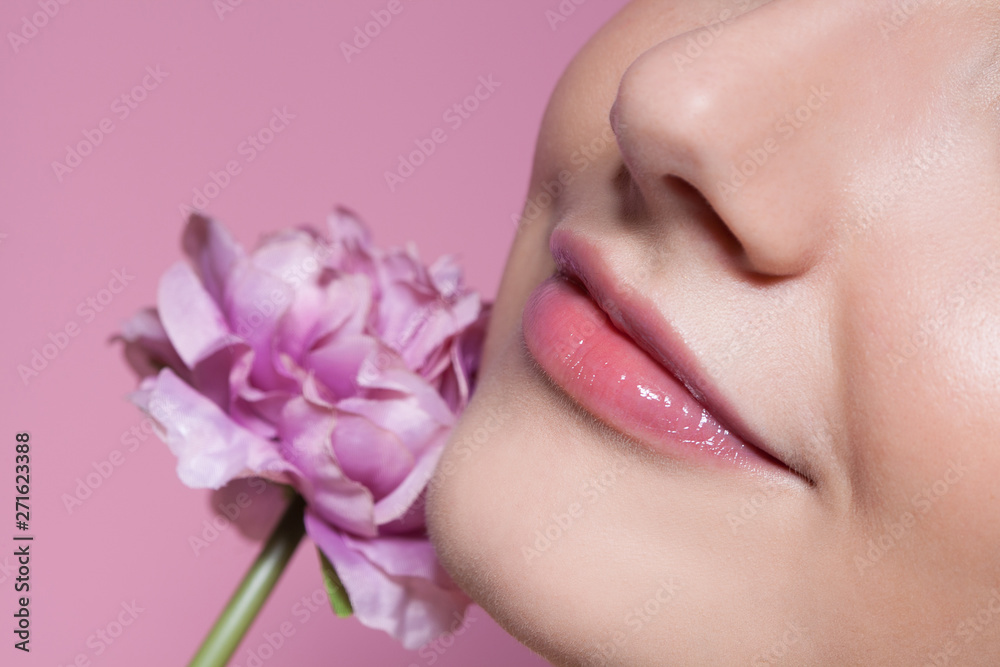 Young beautiful woman with flower on pink background. Young beautiful woman with flower on pink background.