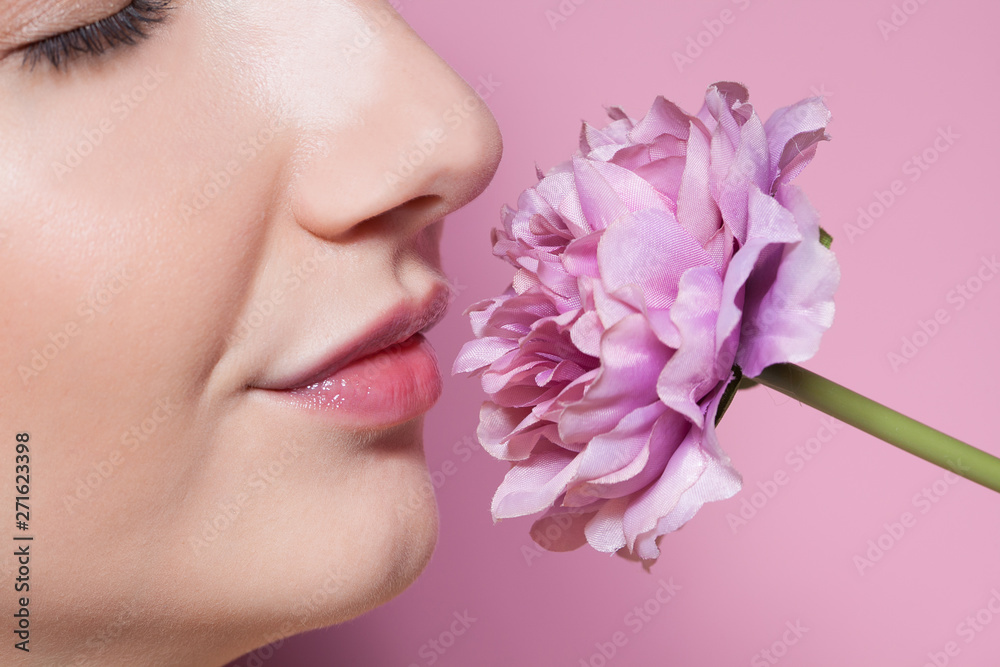 Young beautiful woman with flower on pink background. Young beautiful woman with flower on pink background.