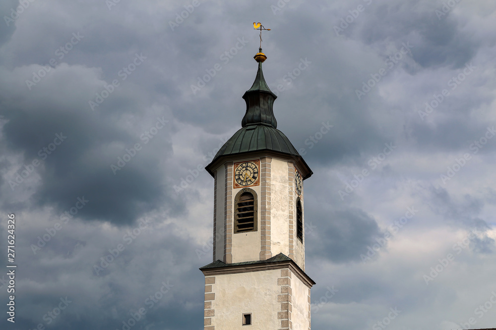 Church spire on a cloudy sky background
