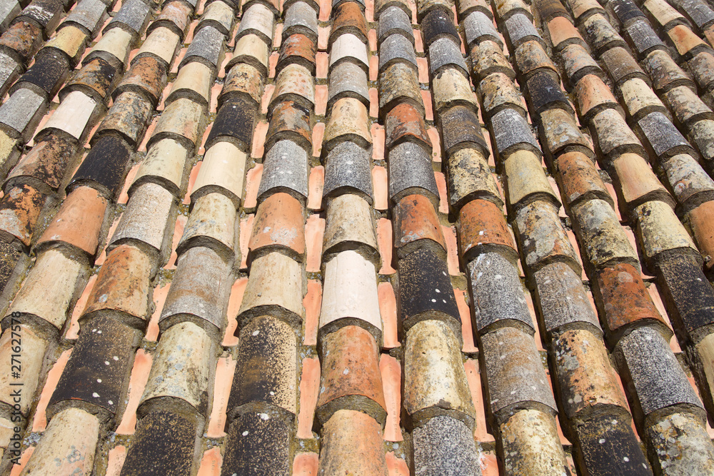 Historical clay roof tiles in laying style monk and nun on the Alcazar in Tarifa