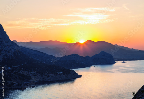 Sunrise, view from Koba Kaya mountain to the surrounding mountains and the Black sea. Crimea, Russia