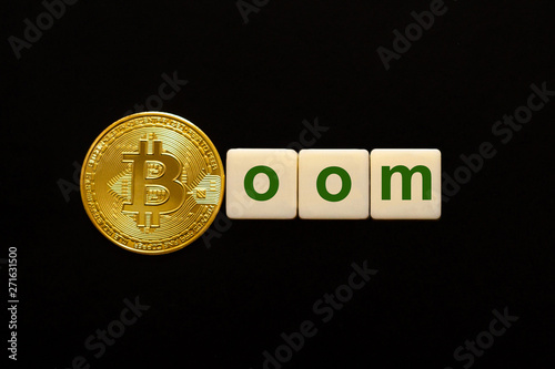 Word Boom made up of cubes. The first letter of the word is symbolized by a bitcoin coin. Concept of strong BTC, bitcoin growth rate, price increase, blockchain confidence, positive price outlook. photo