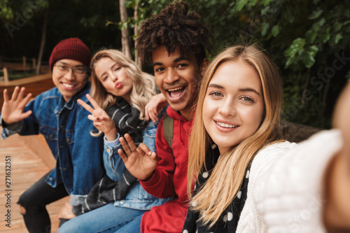 Group if cheerful multiethnic friends teenagers photo