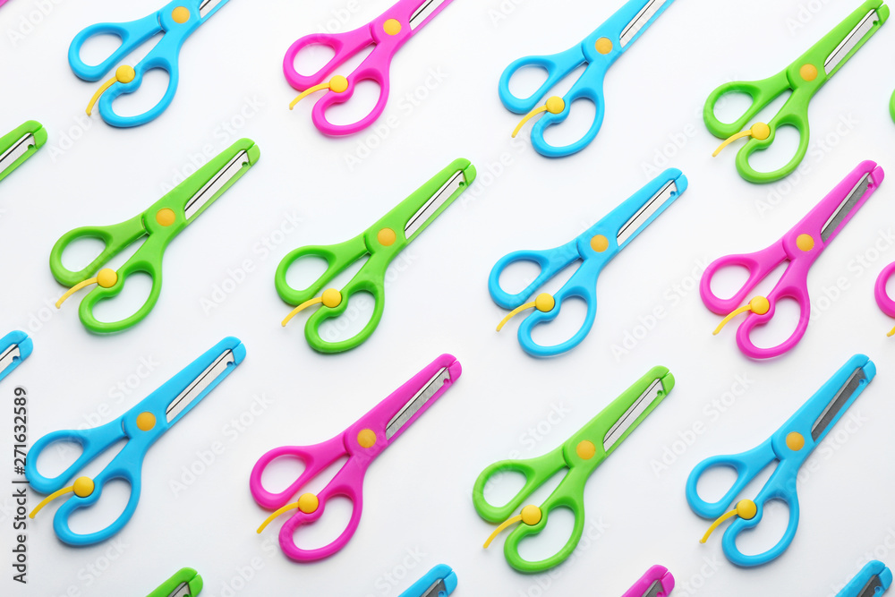 Set of training scissors on white background, top view Set of training scissors on white background, top view