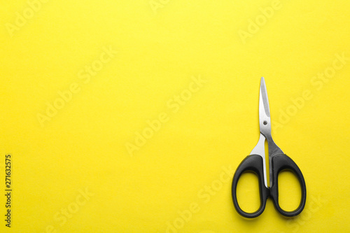 Wallpaper Mural Pair of sharp scissors on color background, top view. Space for text Torontodigital.ca