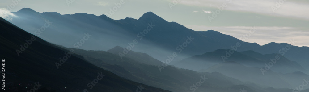 Scenic landscape of mountain shapes. Foggy mountain range. Albania