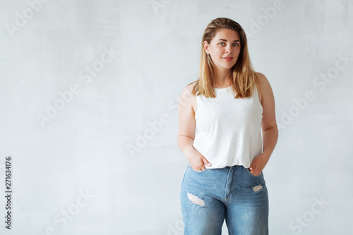 Young beautiful woman in white shirt and jeans