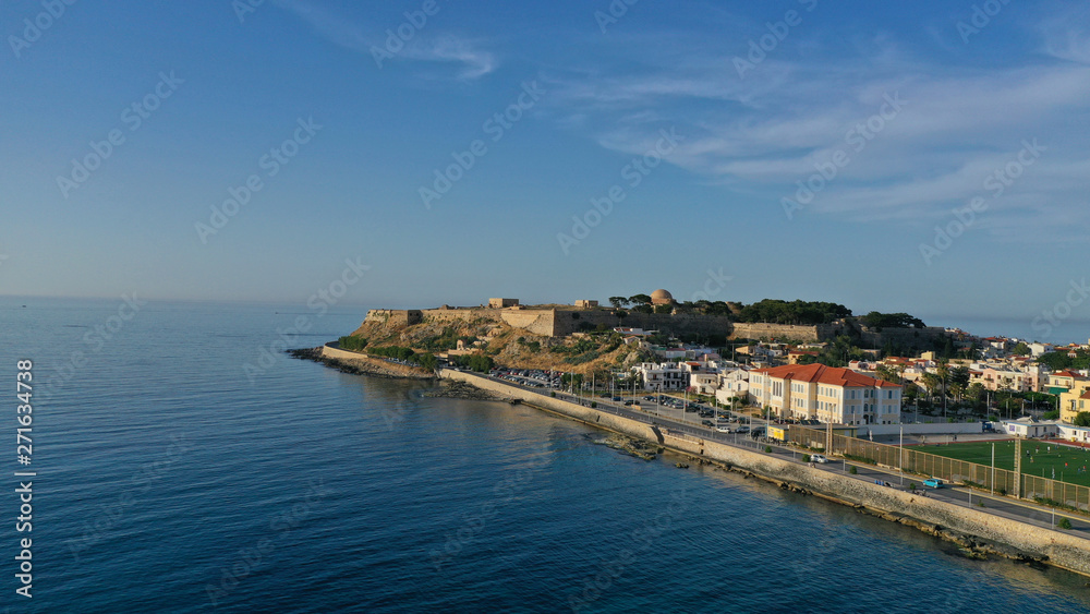 Aerial drone photo of unique old picturesque Venetian port with old lighthouse in the heart of famous city of Rethymno, Crete island, Greece