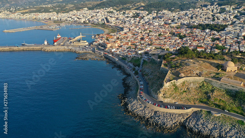 Aerial drone photo of unique old picturesque Venetian port with old lighthouse in the heart of famous city of Rethymno, Crete island, Greece