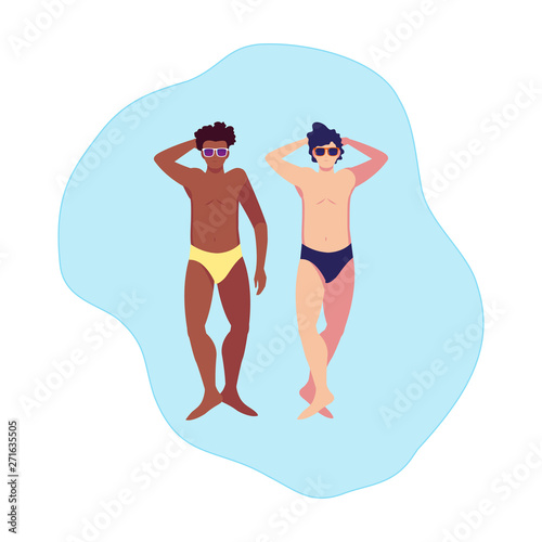 interracial men with swimsuit floating in water © djvstock
