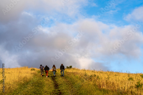 Friends hiking up Hill