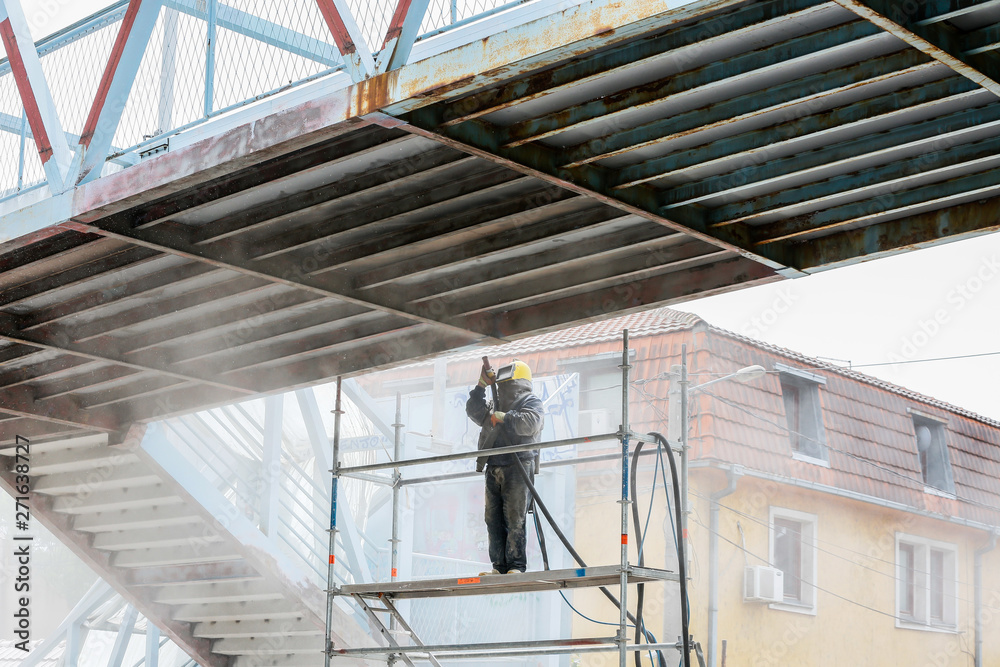 Sand blasting process Industial worker using sand blasting process