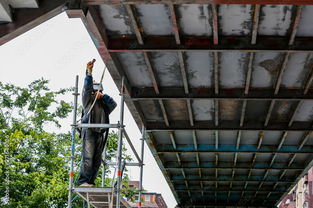 Sand blasting process Industial worker using sand blasting process