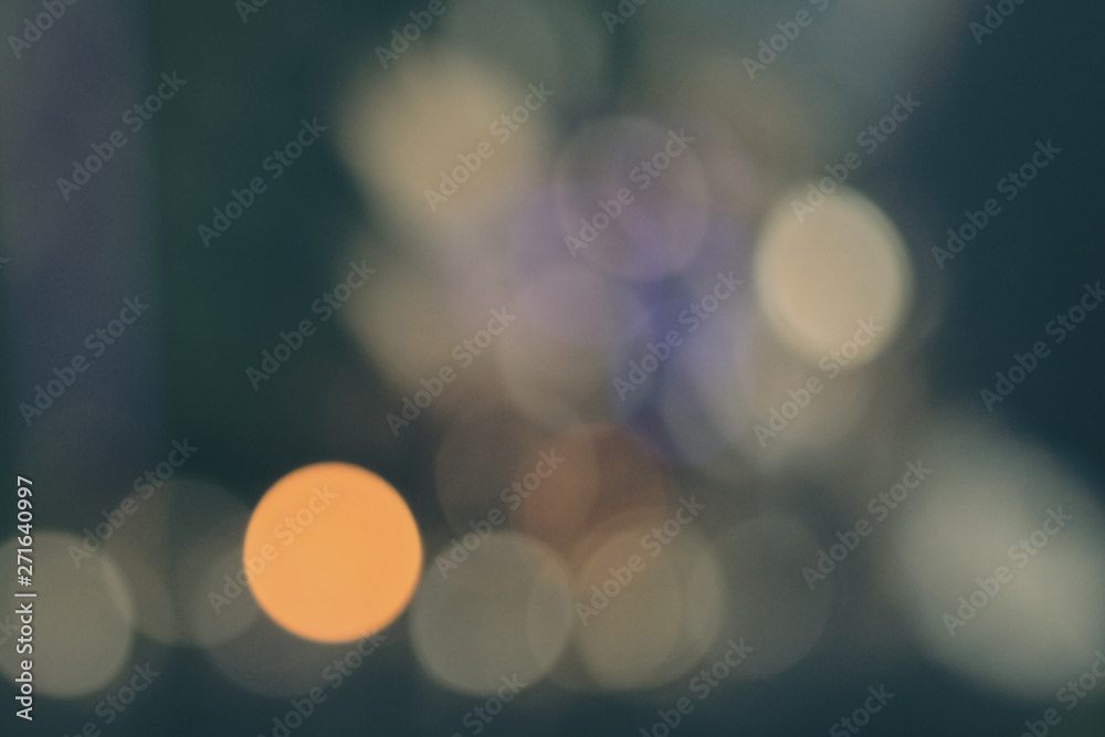 Abstract blue green bokeh background with soft focus christmas lights
