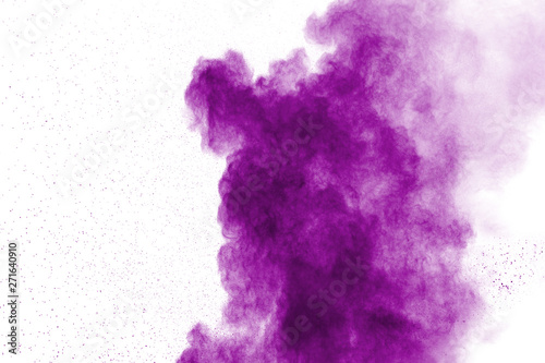 Abstract purple powder explosion on white background. Freeze motion of purple dust splash.