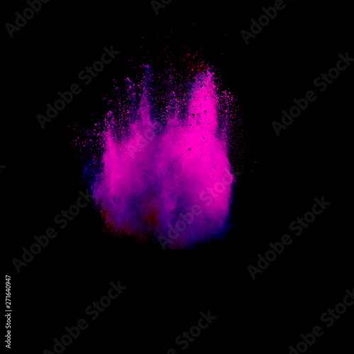Abstract purple powder explosion on black background. Freeze motion of purple dust splash.