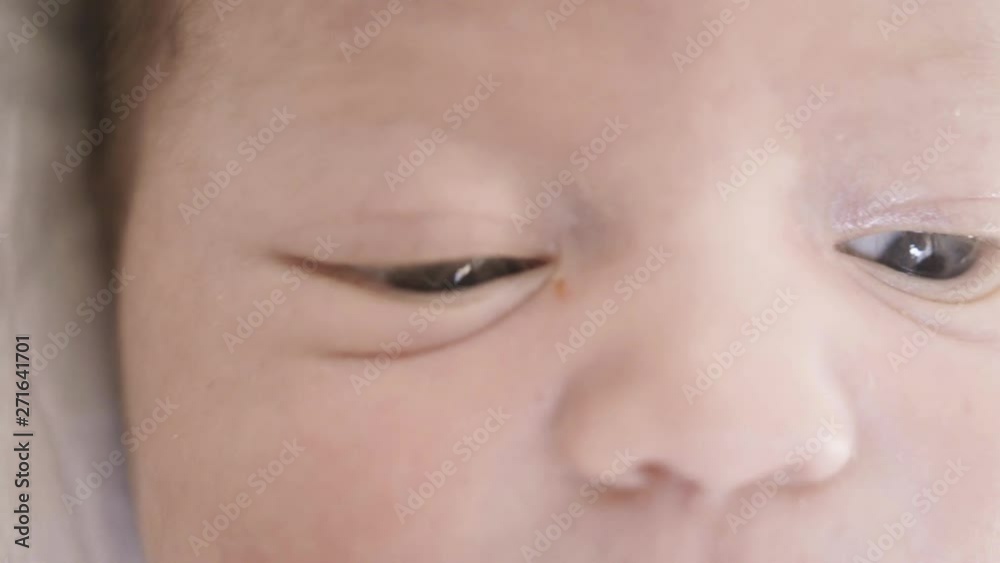 baby face close up looking at camera. baby face close up looking at camera.