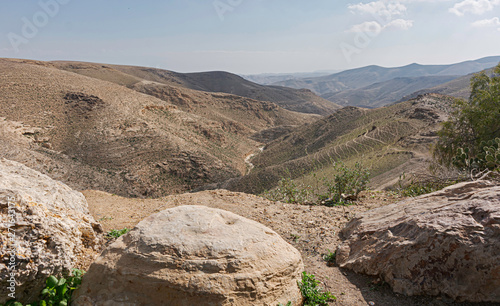 view from nof street overlooking nahal tavya in arad in israel looking southeast showing the dry tavia streambed and the landforms of the judaean mountains and desert photo