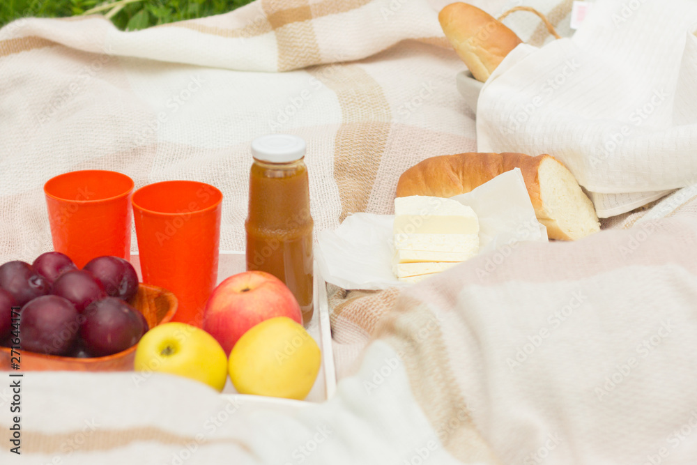 summer picnic, fruit basket,baguette and cheese,light snack on vacation summer picnic, fruit basket,baguette and cheese,light snack on vacation