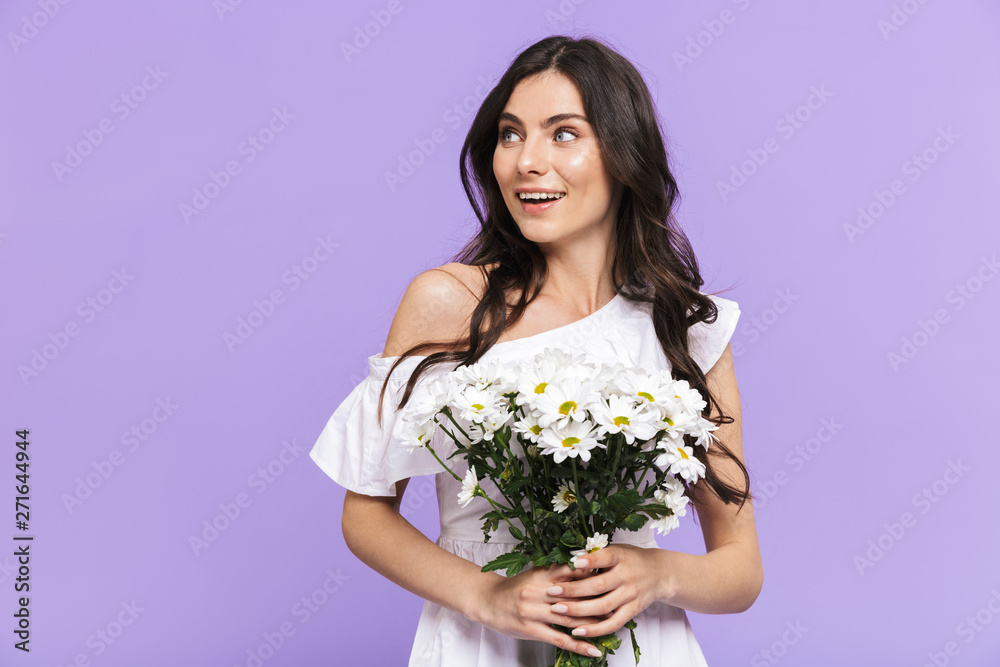 Beautiful young brunette woman standing isolated