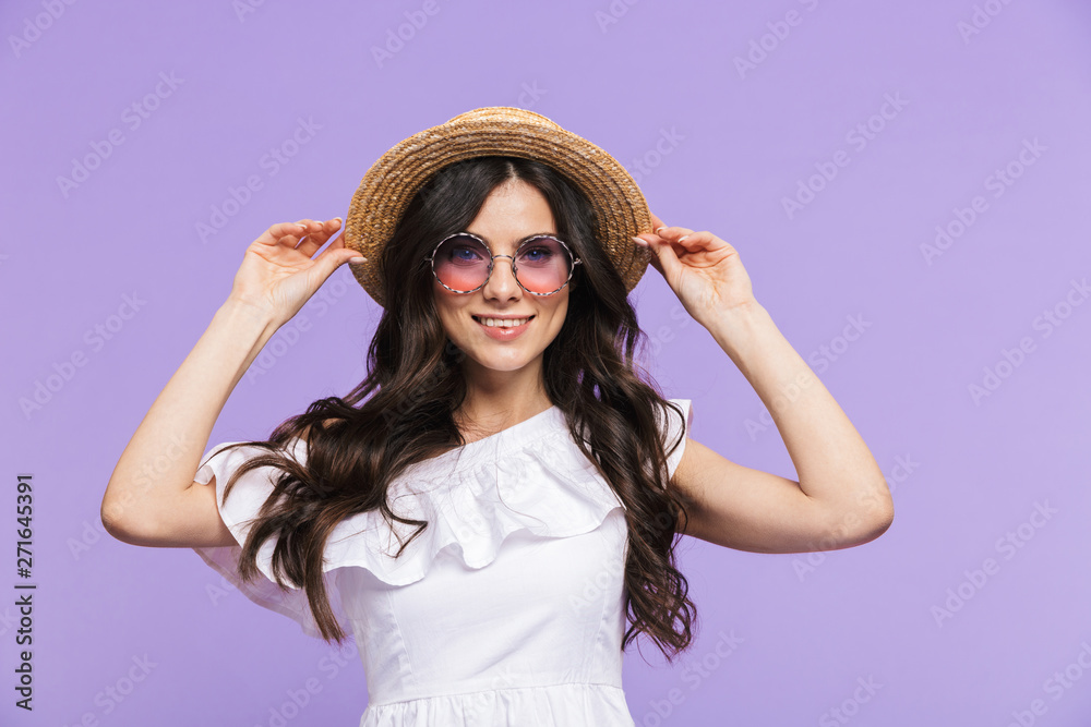 Beautiful young woman wearing summer outfit standing Beautiful young woman wearing summer outfit standing