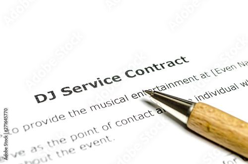 DJ service contract with wooden pen