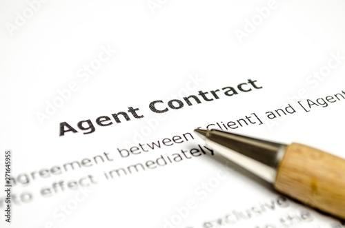 Agent contract with wooden pen