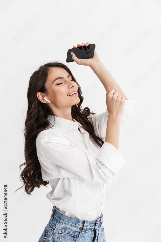 Cheerful young brunette woman wearing shirt Cheerful young brunette woman wearing shirt