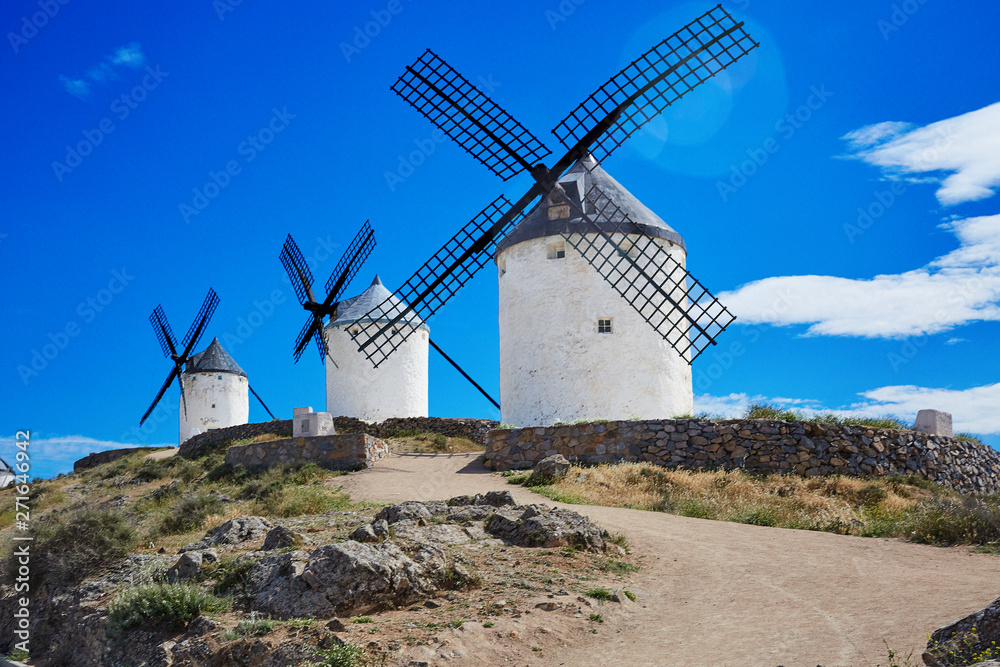 3 Don Quixote windmills with lens flare 3 Don Quixote windmills with lens flare