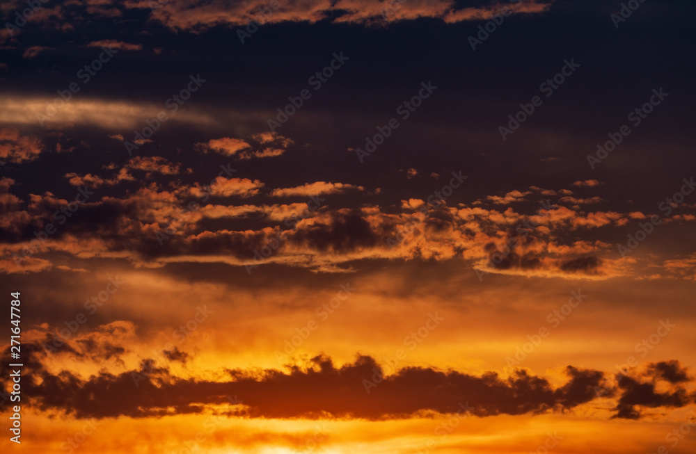 Beautiful sunset with clouds and sun background